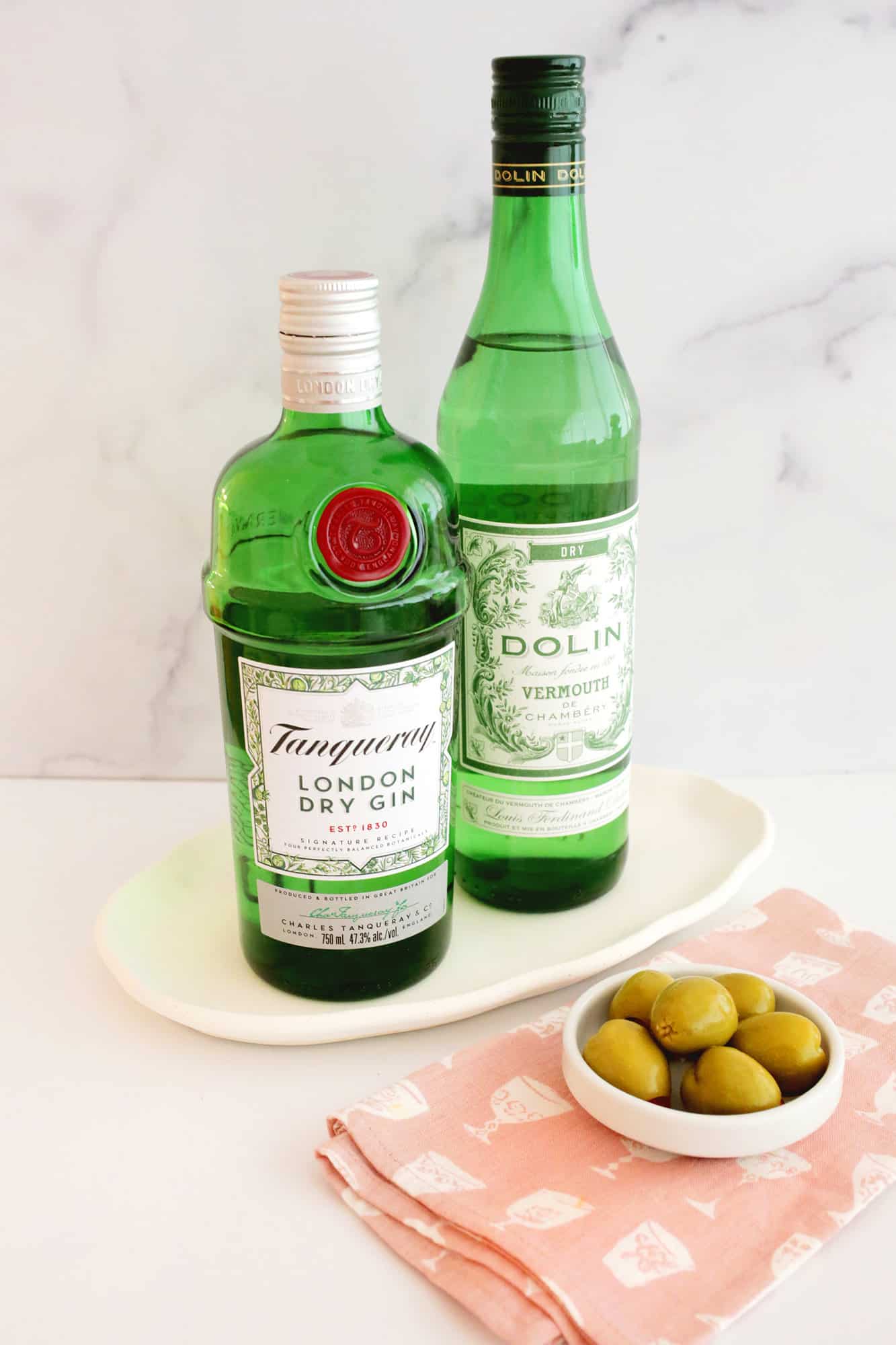 dry martini ingredients with an olive