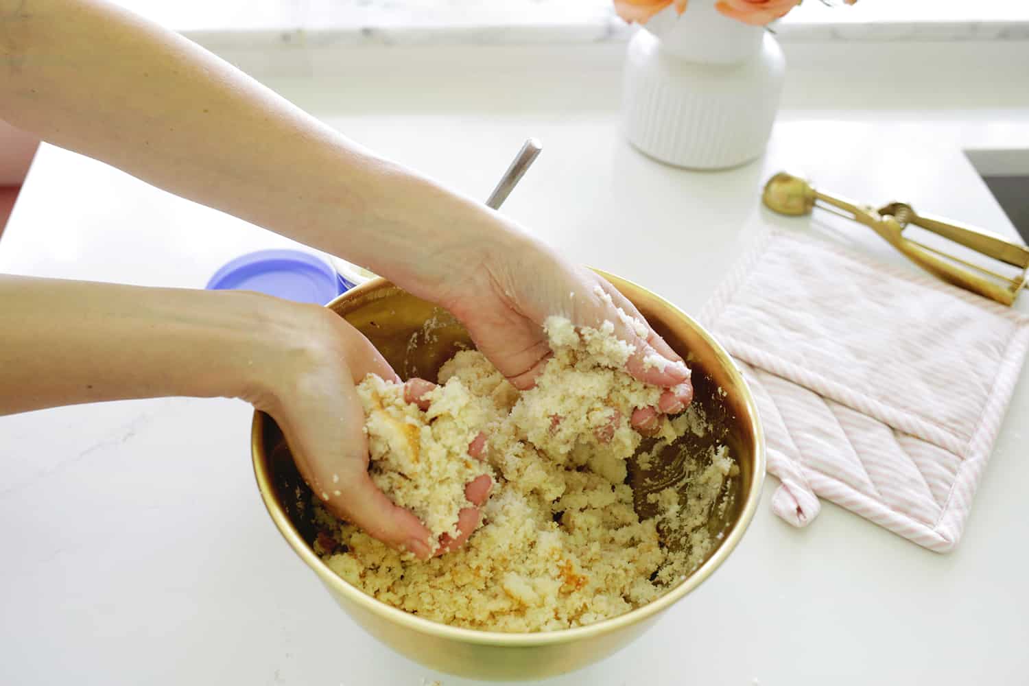 hands crumbling cake for cake pops